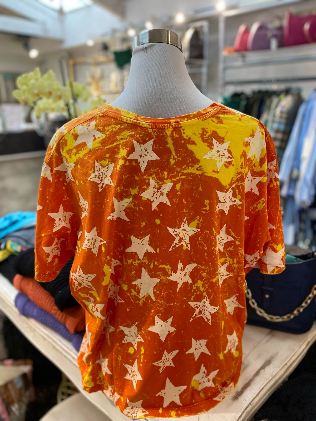 Polera estrellas naranja